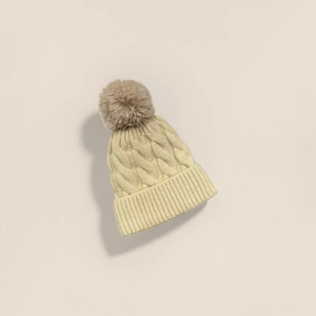 A beige knitted cap with a plush ball for warm autumn and winter women's woolen hat A beige knitted cap with a plush ball for warm autumn and winter women's woolen hat